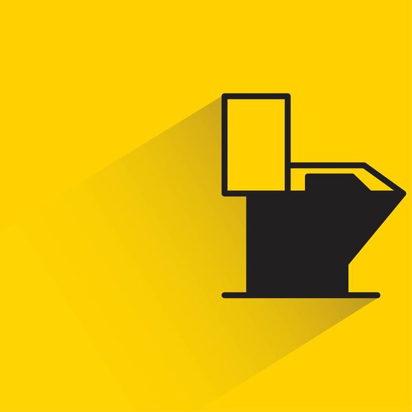 toilet bowl and wc with shadow on yellow background
