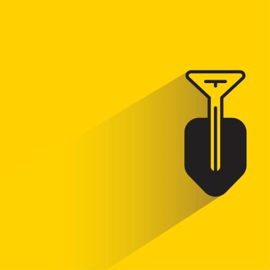 Sarı arkaplanda gölgesi olan kürek simgesi