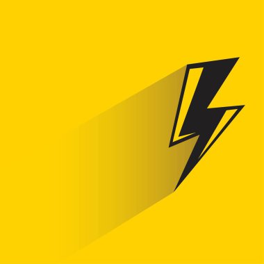 Sarı arkaplanda gölgesi olan şimşek sembolü