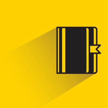 Sarı arkaplanda gölgesi olan kitap simgesi
