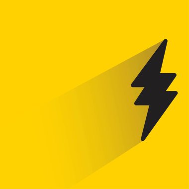 Sarı arkaplanda gölgesi olan şimşek sembolü