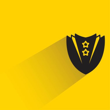 Sarı arka planda gölgesi olan rozet.