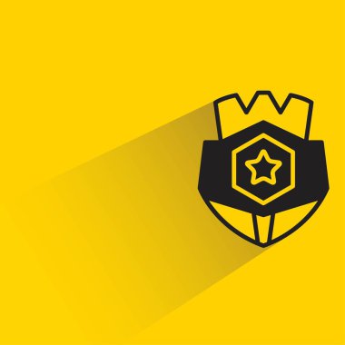 Sarı arka planda gölgesi olan rozet.