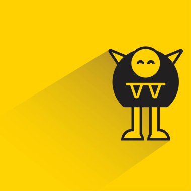 Sarı arka planda gölgesi olan komik canavar karakteri.