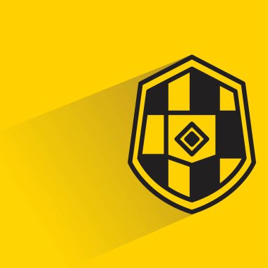Sarı arkaplanda gölgesi olan kalkan simgesi