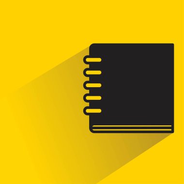Sarı arkaplanda gölgesi olan kitap simgesi