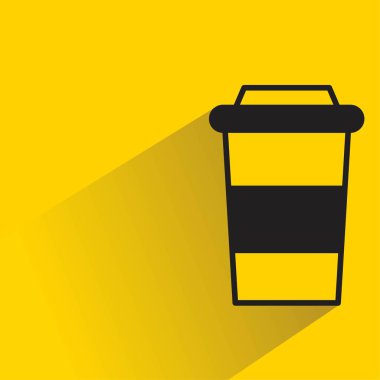 coffee cup with shadow on yellow background