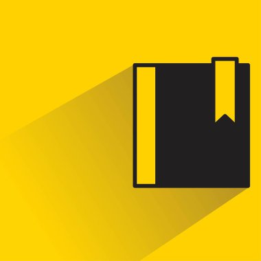 Sarı arkaplanda gölgesi olan kitap simgesi
