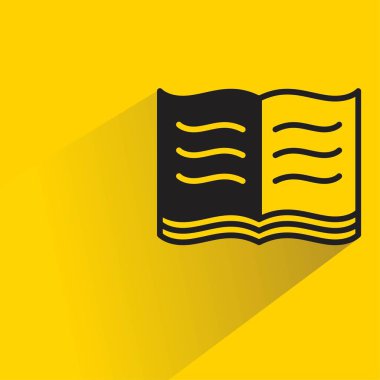 Sarı arkaplanda gölgesi olan kitap simgesi