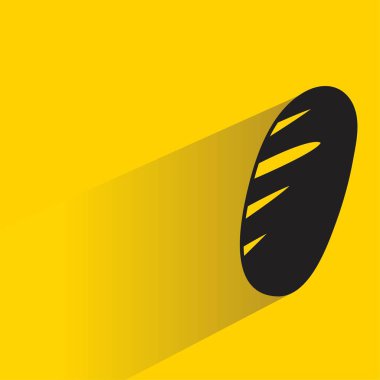 Sarı arkaplanda gölgesi olan çörek.