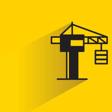 Sarı arkaplanda gölgesi olan port vinç simgesi