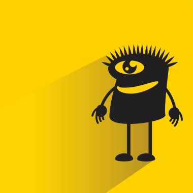 Sarı arka planda gölgesi olan sevimli canavar karakter.