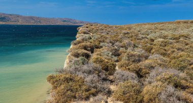 view of beautiful beach with sea waves in gokceada island