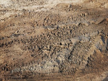Toprak yol arkaplanı veya desen üzerindeki tekerlek izleri