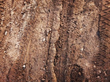 Toprak yol arkaplanı veya desen üzerindeki tekerlek izleri