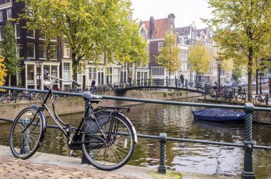 On a bridge over a canal in Amsterdam, Netherlands