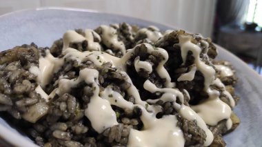 Black rice with sheafood on a plate