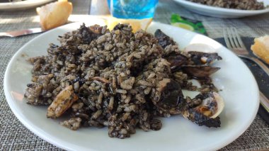 Black rice with sheafood on a plate