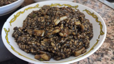 Black rice with sheafood on a plate