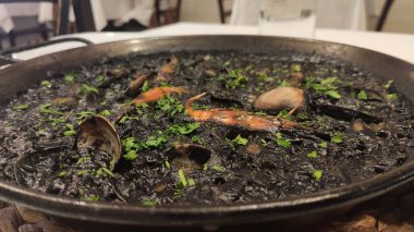 Black rice with sheafood on a plate