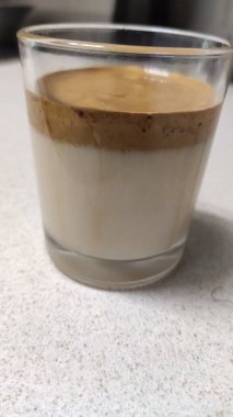Latte macchiato with cocoa powder