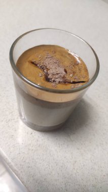 Latte macchiato with cocoa powder