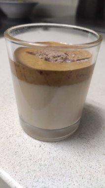 Latte macchiato with cocoa powder