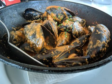 Delicious fresh steamed mussels in white wine sauce