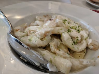 Grilled cuttlefish squid with parsley sauce and garlic