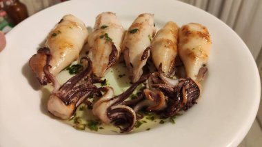 Grilled cuttlefish squid with parsley sauce and garlic