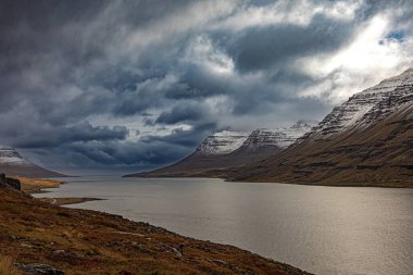 Clouds over Seydisfjordur fjord, Iceland clipart