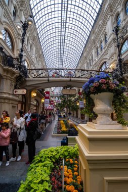 MOSCOW, RUSSIA - AUGUST 2, 2019: GUM, a Long-established, 3-story shopping arcade with a semicircular glass roof & international brands in Nikolskaya Street clipart