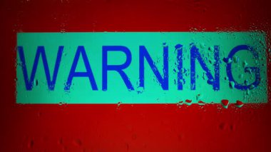 'Uyarı' kelimesi yağmur damlalarıyla kaplıdır