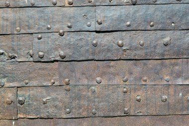 Çivilerle tutturulmuş demir kaplamaların arka planı