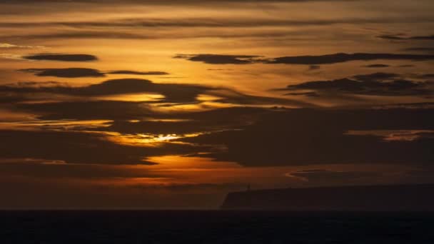 Time Lapse Shows Stunning Sunset Cliffside Lighthouse Sun Illuminates Serene — Stock Video