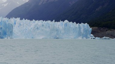 A slow-mo video showing the majestic Perito Moreno Glacier and its tranquil surroundings. clipart