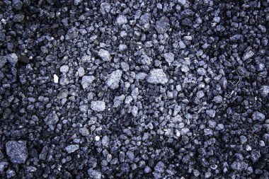 Detail of textured asphalt background, old and shabby road