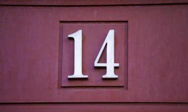 Detail of even number of information on a facade in the city, address
