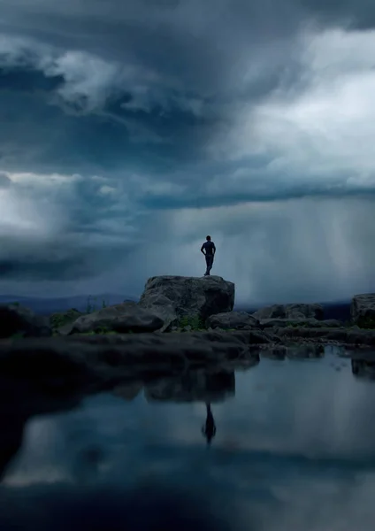 Man Stands Rock Lake Dark Cloudy Sky Render — Stock Photo, Image