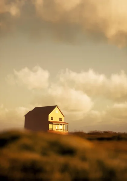 Wooden house with porch and lit windows in sunny countryside under a cloudy sky. 3D render.