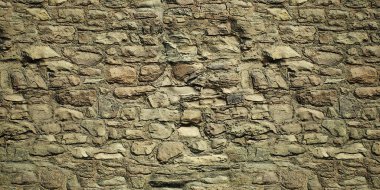 Eski bir taş kale duvarının dokusu.
