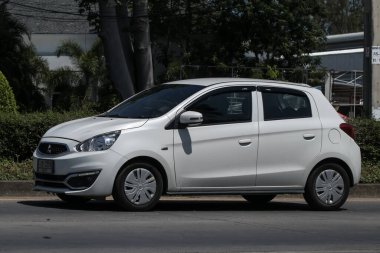 Chiangmai, Thailand -   June  1 2023: Private Eco car Mitsubishi Mirage. On road no.1001 8 km from Chiangmai Business Area.