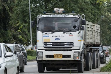 Chiangmai, Thailand -  September 12 2023: Private Isuzu Trailer Dump Truck. On road no.1001 8 km from Chiangmai Business Area. clipart
