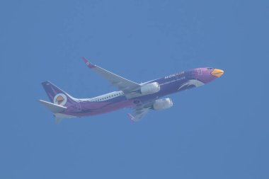 Chiangmai, Thailand -  November 22 2023: HS-DBU Boeing 737-800 of NokAir . Take off from Chiangmai airport to Bangkok. clipart