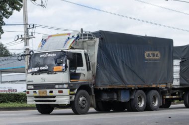 Chiangmai, Thailand -  October  2 2023: Private Hino  Cargo Truck. Photo at road no.1001 about 8 km from downtown Chiangmai, thailand.