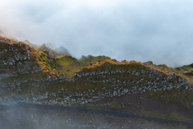 Stunning aerial shot capturing the rugged beauty of the Faroe Islands, shrouded in mist as summer ends. Perfect for nature lovers. clipart