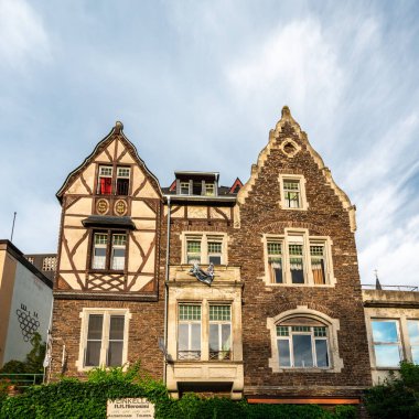 Explore the stunning blend of traditional and modern architecture near Cochem Castle, Germany in summer light. clipart