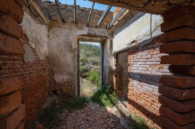 Abandoned house with traces of devastation and rot. Missing roof, grafitti etc. High quality photo clipart