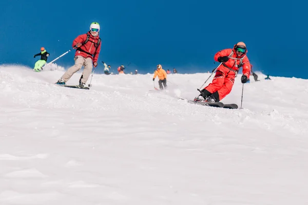 stock image Karpaty, Ukraine, February 8, 2023. Skiers and snowboarders freeride in clear sunny weather on the slopes of the mountains near the resort of Dragobrat. High quality photo