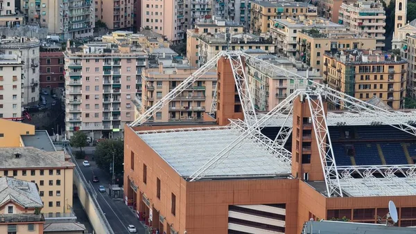 stock image Genoa, Italy - May 6, 2023: Top view of the city of Genoa at sunset from the mountains. Aerial view of Genoa and Sampdoria soccer teams stadium in Genoa Marassi in Italy.